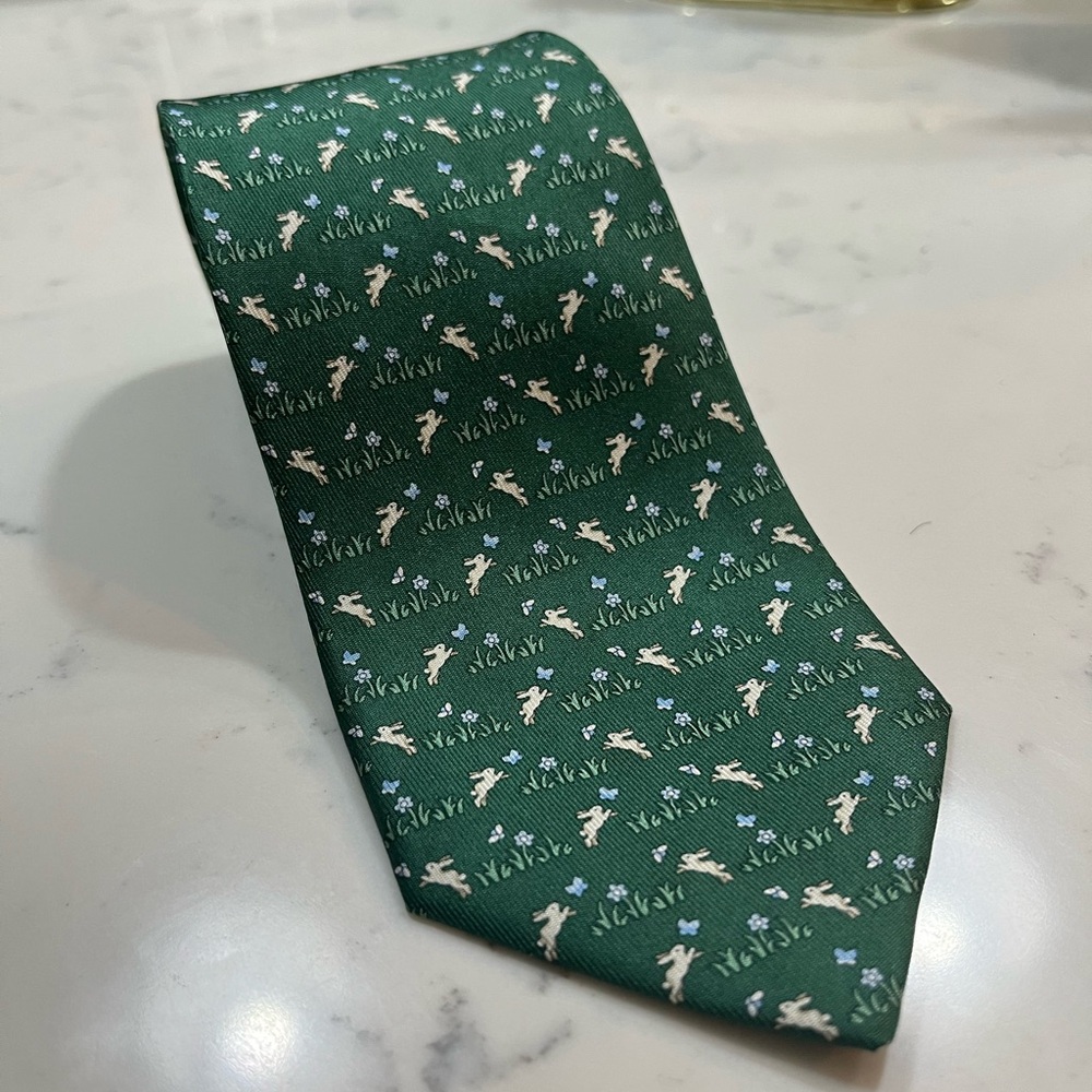 Never worn men’s silk necktie by Ferragamo with bunny hopping pattern.